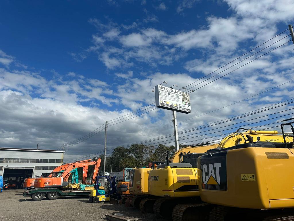CAT and Sumitomo excavators inside the HSK Japan machinery yard
